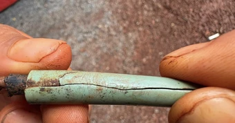 Phát hiện cây bút khắc tên 'Văn Chín' bên hài cốt liệt sĩ ở Đồng Nai