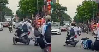 Nữ sinh bị bạn giật tóc, ngã lăn xuống đường