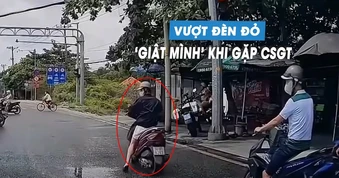 Thanh niên lái xe máy vượt đèn đỏ, 'hết hồn' phanh gấp khi thấy CSGT