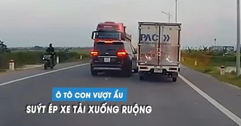 Xe tải suýt lao xuống ruộng vì bị ô tô con vượt ẩu, tạt đầu