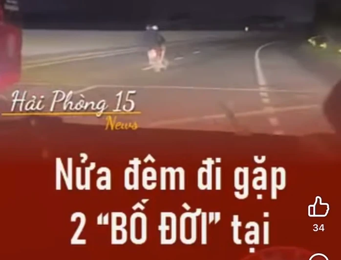 Hai người đàn ông đầu trần, đi xe máy lạng lách, đánh võng trên quốc lộ